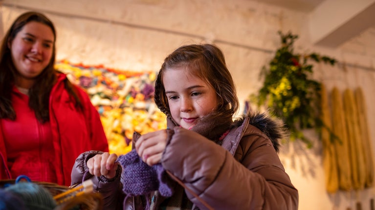 Visitors enjoying craft activities at Fountains Abbey and Studley Royal Water Garden, North Yorkshire